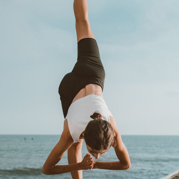 Person stretching outdoors feeling refreshed and flexible.